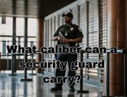 an armed security guard working holding his gun