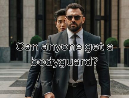 Bodyguard stands firm beside VIP.